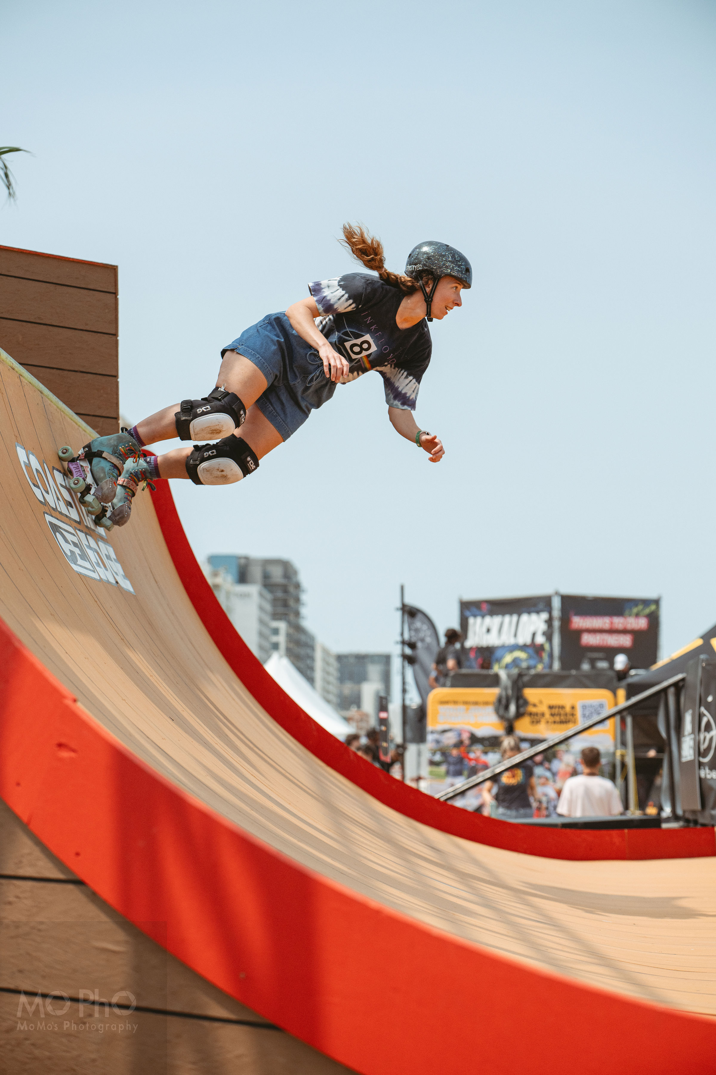 Female roller skater on vert ramp Super Girl Fest Virginia Beach